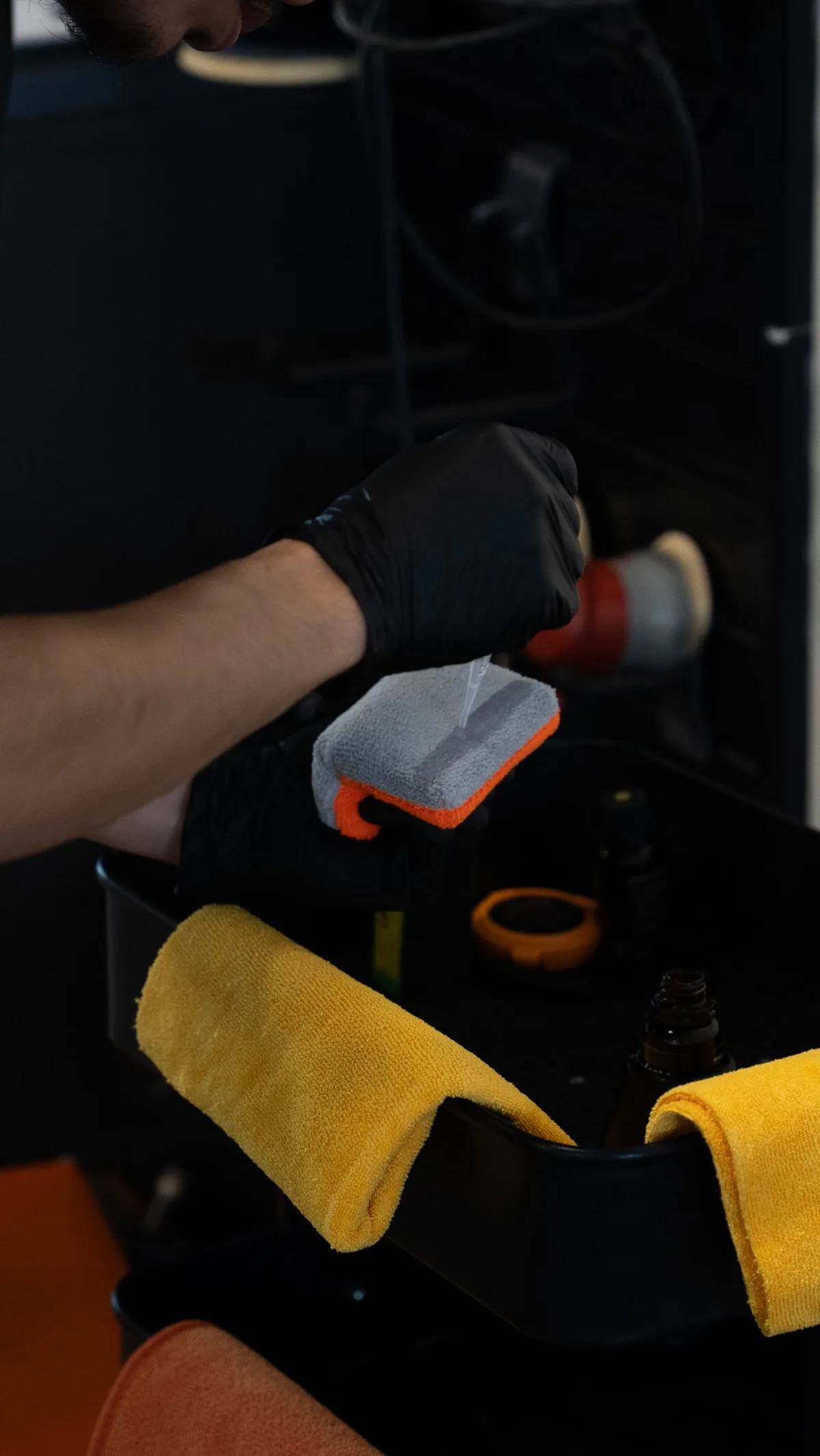 Ceramic coating being applied to a panel